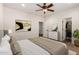 Comfortable bedroom featuring a ceiling fan, carpeted floors, and closet space, providing a relaxing retreat at 14539 W Sheridan St, Goodyear, AZ 85395