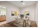 Bright office space with modern desk, stylish decor, and a view of the connected bathroom offering a productive work environment at 14539 W Sheridan St, Goodyear, AZ 85395
