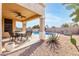 Covered patio, pool, and relaxing lounge chairs at 1653 W Glenhaven Dr, Phoenix, AZ 85045