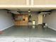 Garage with storage cabinets and overhead racks at 1653 W Glenhaven Dr, Phoenix, AZ 85045