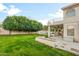 Spacious backyard with a large grassy area and patio at 1763 S Red Rock St, Gilbert, AZ 85295