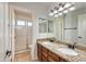 Bathroom with double sinks and granite countertop at 1763 S Red Rock St, Gilbert, AZ 85295