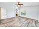Bedroom with wood-look floors and access to bathroom at 1763 S Red Rock St, Gilbert, AZ 85295