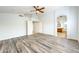 Spacious bedroom with wood-look flooring and ceiling fan at 1763 S Red Rock St, Gilbert, AZ 85295