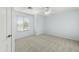 Bedroom with carpet, window, and ceiling fan, ready for personalization at 1763 S Red Rock St, Gilbert, AZ 85295