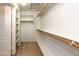Walk-in closet with shelves and hanging rods at 1763 S Red Rock St, Gilbert, AZ 85295