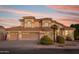 Two-story house with three-car garage and landscaped front yard at 1763 S Red Rock St, Gilbert, AZ 85295