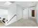 Upstairs hallway with skylight, fresh paint, carpet flooring, and access to bedrooms at 1763 S Red Rock St, Gilbert, AZ 85295