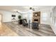 Open living room with wood floors and a stone fireplace at 1763 S Red Rock St, Gilbert, AZ 85295