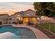 Inviting backyard pool with patio seating at 1763 S Red Rock St, Gilbert, AZ 85295