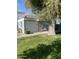 Residential building with a grassy yard and mature tree in front at 2687 W Ocotillo Rd, Phoenix, AZ 85017