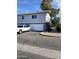 Gray duplex with attached garage and driveway, offering convenient parking at 2687 W Ocotillo Rd, Phoenix, AZ 85017