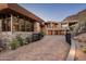 Modern home with stone exterior and gated entryway at 42493 N 108Th St, Scottsdale, AZ 85262