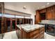 Luxury laundry room with granite countertop and modern appliances at 42493 N 108Th St, Scottsdale, AZ 85262