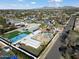 Aerial view of house, pool, and backyard; tennis court visible at 4461 E Flower St, Phoenix, AZ 85018