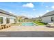 Expansive backyard featuring a sparkling pool, sun loungers, and manicured landscaping for luxurious outdoor living at 6040 E Lafayette Blvd, Scottsdale, AZ 85251