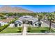 Stunning home with lush front lawn, walkway, and a striking architectural design, showcasing curb appeal at 6040 E Lafayette Blvd, Scottsdale, AZ 85251