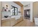 Stylish kitchen with custom cabinets, marble backsplash, and modern fixtures, creating a sleek and functional space at 6040 E Lafayette Blvd, Scottsdale, AZ 85251