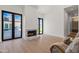 Bright room with a fireplace and sliding glass doors offering views of the yard, providing seamless indoor-outdoor living at 6040 E Lafayette Blvd, Scottsdale, AZ 85251