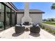 Inviting outdoor patio with a gas fireplace and comfortable seating, perfect for entertaining at 6040 E Lafayette Blvd, Scottsdale, AZ 85251