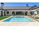 Sparkling pool and patio area with lounge chairs and umbrella providing a relaxing outdoor space at 6040 E Lafayette Blvd, Scottsdale, AZ 85251
