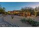 Landscaped backyard with pool and outdoor lighting at 6074 E Los Reales Dr, Carefree, AZ 85377