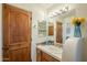 Simple bathroom with a vanity, sink, and wood cabinets at 6074 E Los Reales Dr, Carefree, AZ 85377