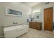 Modern bathroom with a large soaking tub and a stylish vanity at 6074 E Los Reales Dr, Carefree, AZ 85377