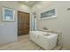 Bathroom featuring a freestanding tub and wood cabinets at 6074 E Los Reales Dr, Carefree, AZ 85377