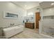 Spa-like bathroom featuring a large soaking tub and walk-in shower at 6074 E Los Reales Dr, Carefree, AZ 85377