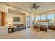 Primary bedroom with king bed, access to patio, and mountain views at 6074 E Los Reales Dr, Carefree, AZ 85377