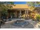 Spanish-style home with a beautiful courtyard featuring a fountain and seating area at 6074 E Los Reales Dr, Carefree, AZ 85377