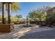 Backyard oasis with a fountain, seating, and desert landscaping at 6074 E Los Reales Dr, Carefree, AZ 85377