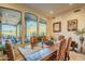 Bright dining room with mountain views and wood table at 6074 E Los Reales Dr, Carefree, AZ 85377