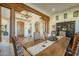 Rustic dining room with wood table and views to the entry at 6074 E Los Reales Dr, Carefree, AZ 85377