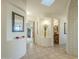 Elegant entryway with tile flooring, decorative wall niches, and a large mirror at 6074 E Los Reales Dr, Carefree, AZ 85377