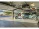 Spacious garage with overhead storage and flooring at 6074 E Los Reales Dr, Carefree, AZ 85377