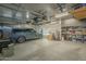Finished garage with overhead storage and shelving at 6074 E Los Reales Dr, Carefree, AZ 85377