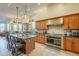 Gourmet kitchen boasts granite counters, stainless steel appliances, and custom wood cabinetry at 6074 E Los Reales Dr, Carefree, AZ 85377