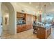 Kitchen with island, wooden cabinetry, and granite countertops at 6074 E Los Reales Dr, Carefree, AZ 85377