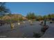 Desert landscaping with lighting and walkways at 6074 E Los Reales Dr, Carefree, AZ 85377