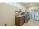 Laundry room with washer, dryer, sink, and built-in cabinets at 6074 E Los Reales Dr, Carefree, AZ 85377