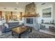Spacious living room with a stone fireplace and built-in entertainment center at 6074 E Los Reales Dr, Carefree, AZ 85377