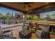 Covered patio with seating area and outdoor kitchen at 6074 E Los Reales Dr, Carefree, AZ 85377