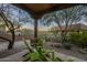 Relaxing patio area with two green Adirondack chairs and desert landscaping at 6074 E Los Reales Dr, Carefree, AZ 85377