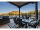 Covered patio with dining area and mountain views at 6074 E Los Reales Dr, Carefree, AZ 85377