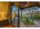 Private patio with green chairs and desert landscape views at 6074 E Los Reales Dr, Carefree, AZ 85377