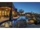 Luxury backyard oasis featuring a large pool and spa at 6074 E Los Reales Dr, Carefree, AZ 85377