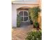 Front entrance with security gate and nicely landscaped area at 9217 N 106Th Way, Scottsdale, AZ 85258