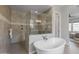 Spa-like bathroom with walk-in shower and soaking tub at 10547 E Thornton Ave, Mesa, AZ 85212